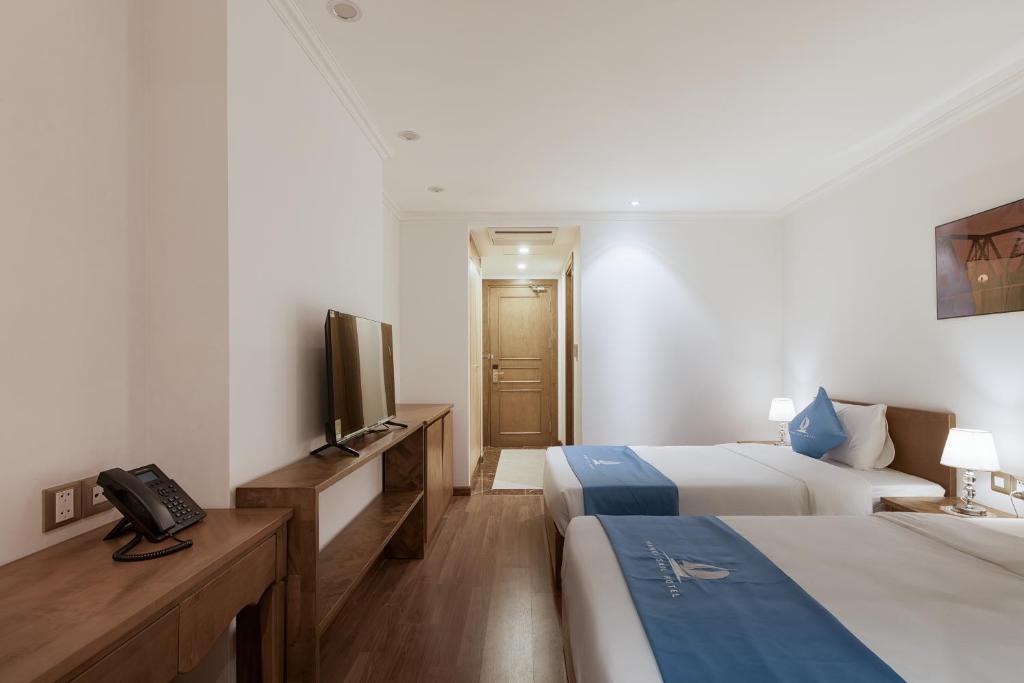 TV a/nebo společenská místnost v ubytování Hanoi Sail Hotel