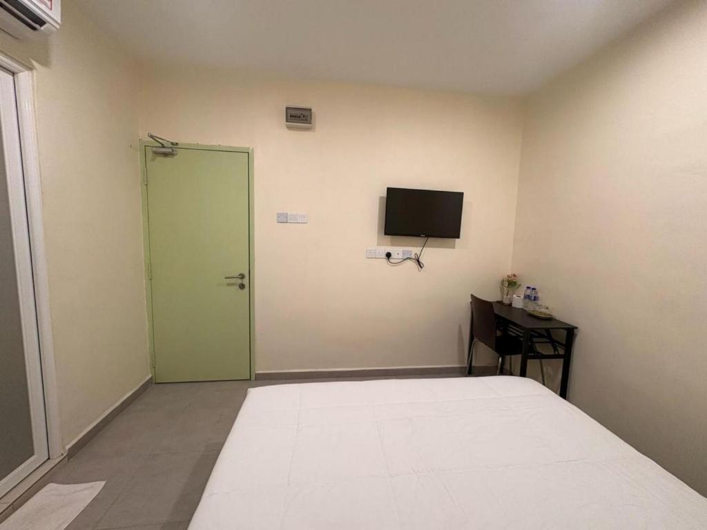 TV a/nebo společenská místnost v ubytování Aman Inn Hotel