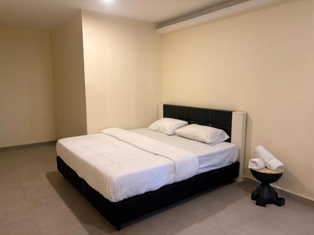 Postel nebo postele na pokoji v ubytování Aman Inn Hotel