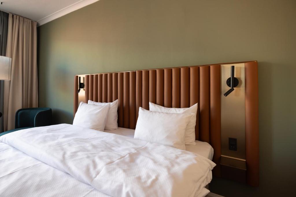 Postel nebo postele na pokoji v ubytování Imperial Hotel