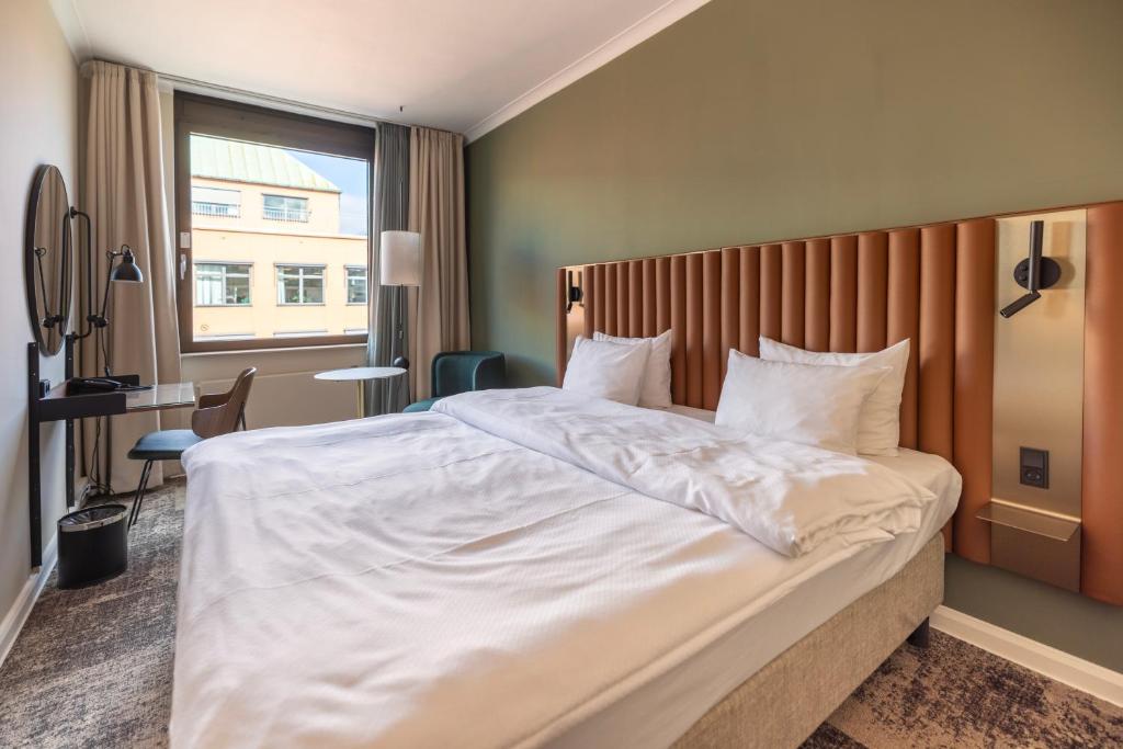Postel nebo postele na pokoji v ubytování Imperial Hotel