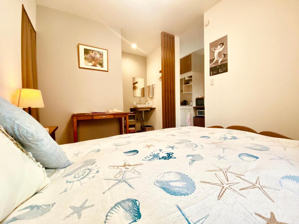 Postel nebo postele na pokoji v ubytování 遥華-Haruka House