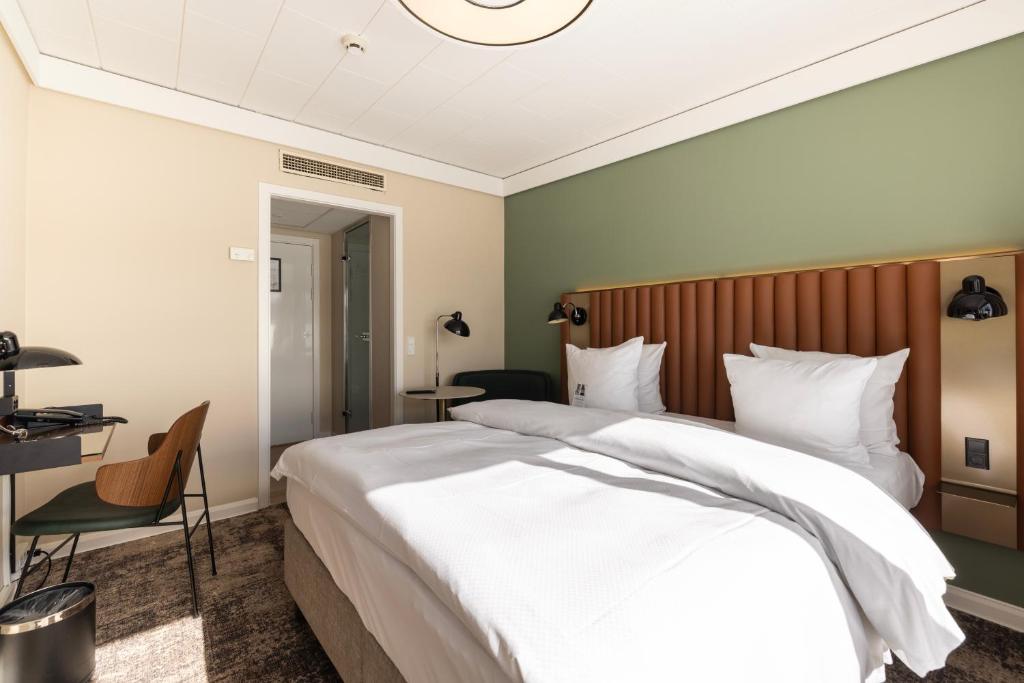 Postel nebo postele na pokoji v ubytování Imperial Hotel