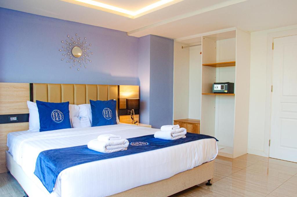 Postel nebo postele na pokoji v ubytování HT9 Hotel