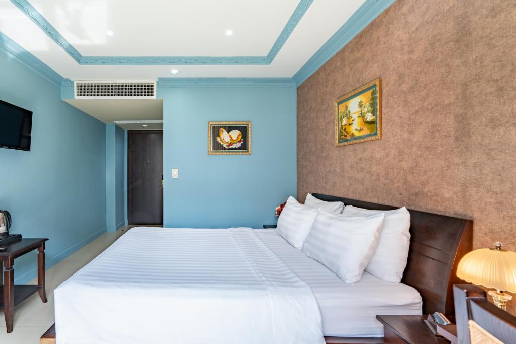 Giường trong phòng chung tại La Bonita Boutique Hotel