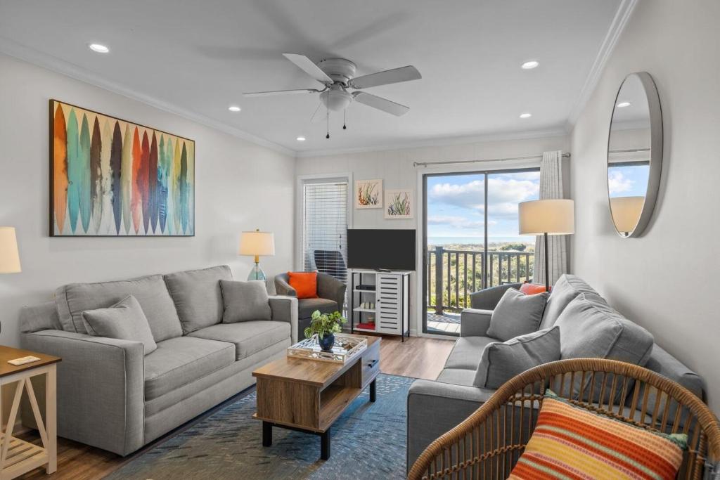 a living room with a couch and a table at Southwinds G10 Ocean View condo in Atlantic Beach