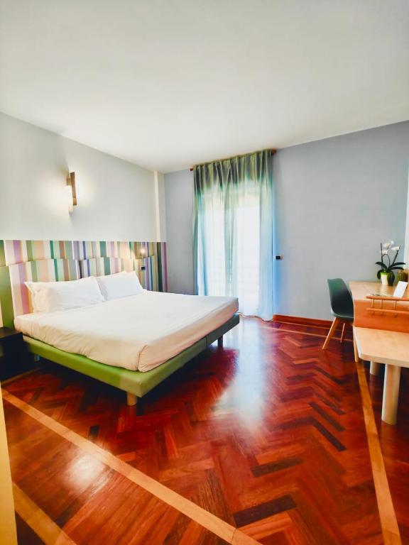Postel nebo postele na pokoji v ubytování HA Hotel