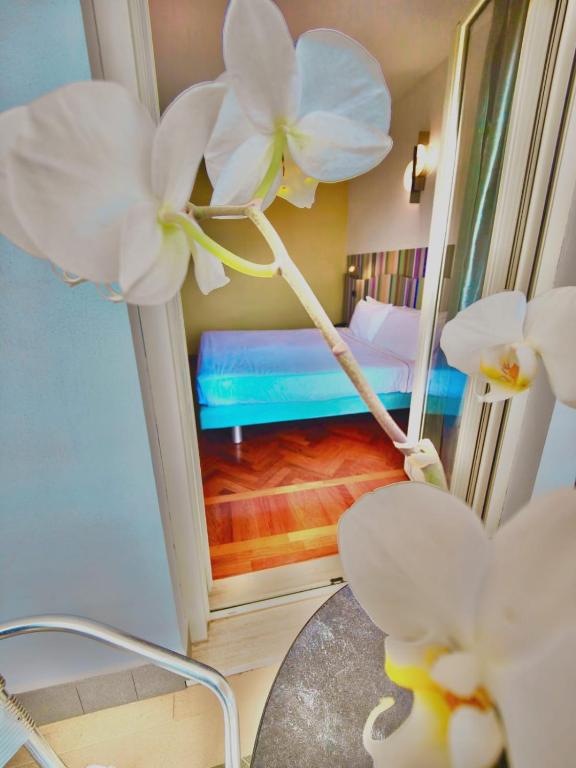 Postel nebo postele na pokoji v ubytování HA Hotel