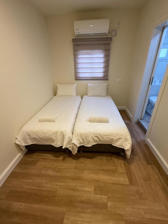 a bedroom with a bed with two pillows on it at Bella Vista House in Eilat