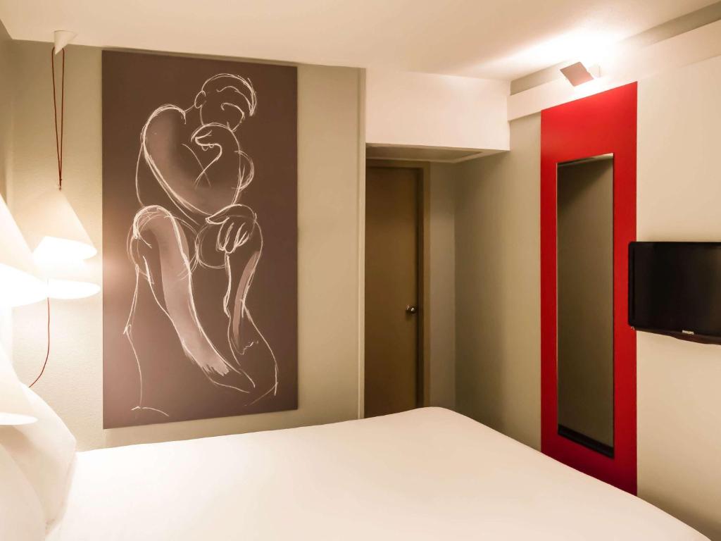 Cama ou camas em um quarto em Hotel ibis Evora