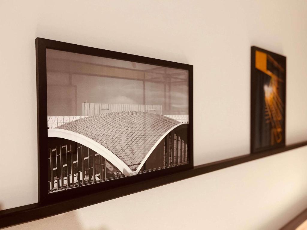 a picture frame on a shelf in a room at ibis Hotel Dortmund City in Dortmund
