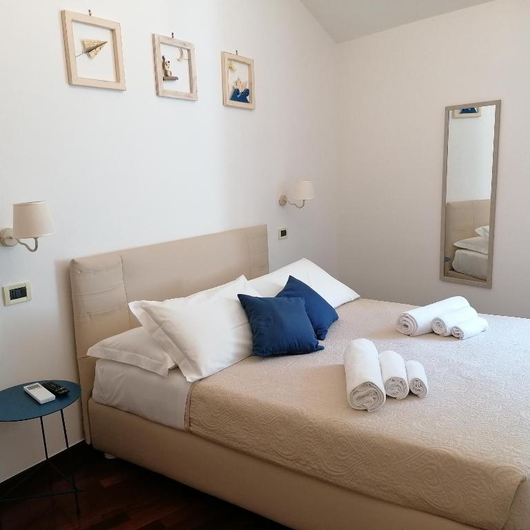 Postel nebo postele na pokoji v ubytování B&B Capo Le Vigne