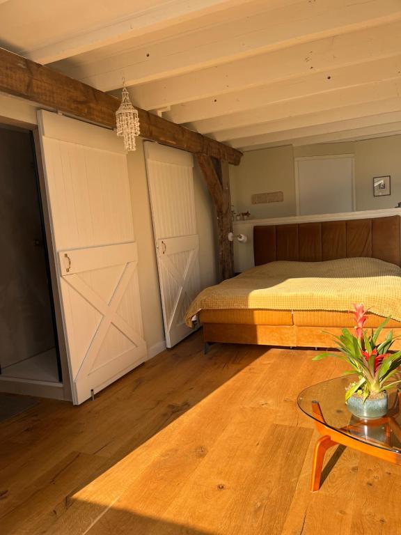 Postel nebo postele na pokoji v ubytování B&B De Vrijbuiter