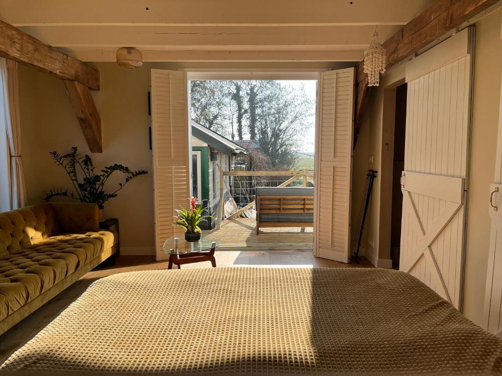 Postel nebo postele na pokoji v ubytování B&B De Vrijbuiter