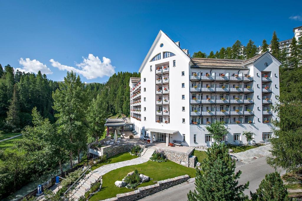 an aerial view of a hotel in the mountains at Hotel Schweizerhof Sils Maria, a Faern Collection Hotel in Sils Maria