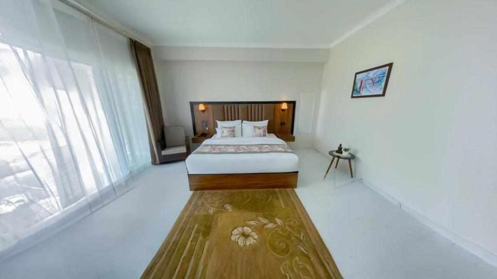Postel nebo postele na pokoji v ubytování Yashshree Resorts & Spa Kalimpong