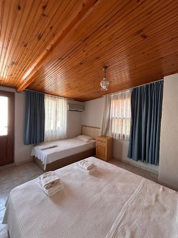 Postel nebo postele na pokoji v ubytování Golden Pension