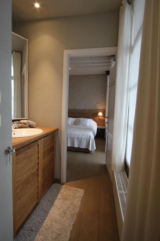 Postel nebo postele na pokoji v ubytování De Waterzooi Suites