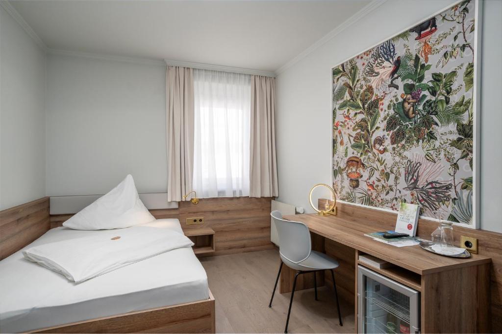 Postel nebo postele na pokoji v ubytování Hotel Kongress