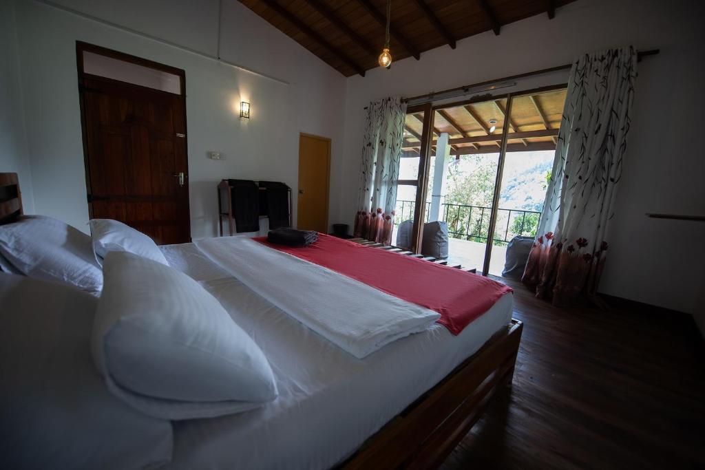 Postel nebo postele na pokoji v ubytování Minthu Homestay