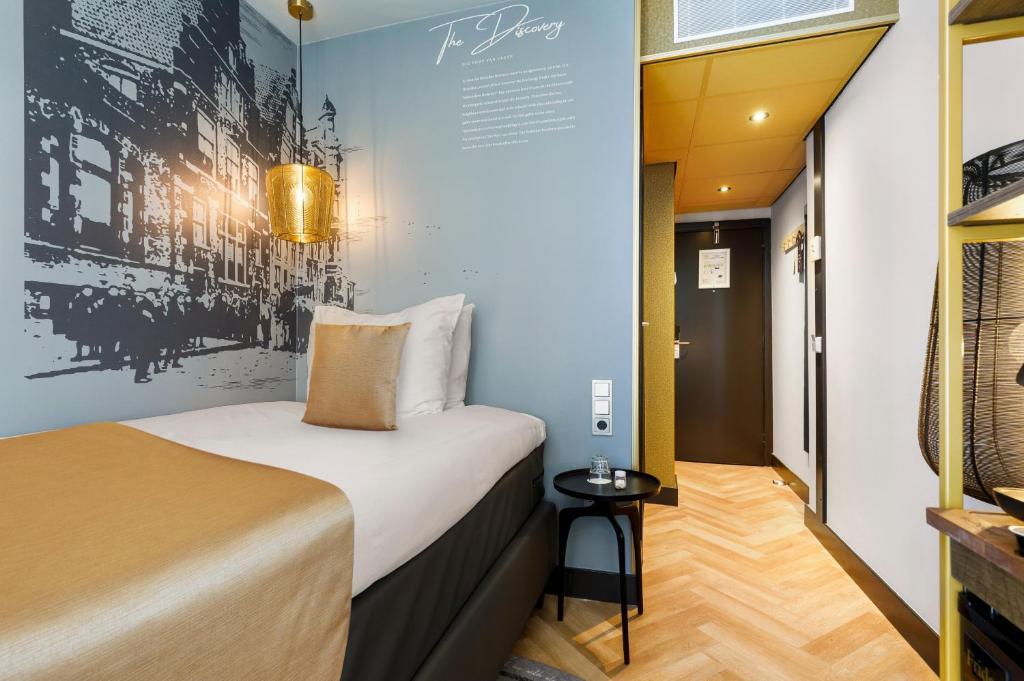 Een bed of bedden in een kamer bij Hotel Die Port van Cleve
