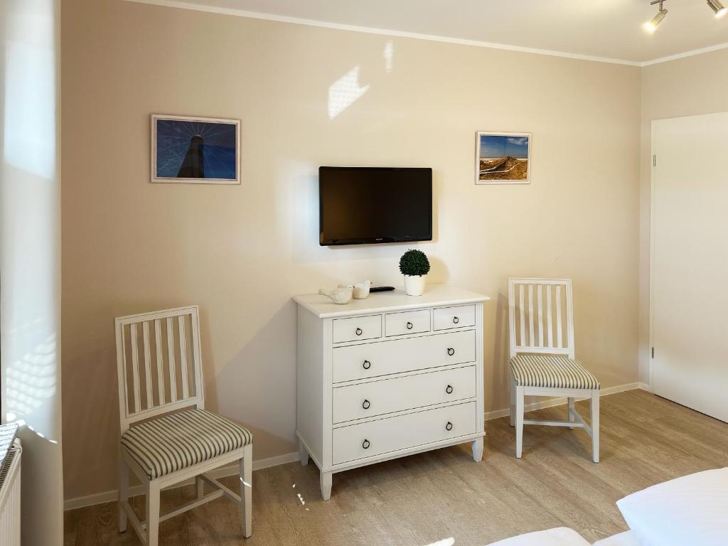 TV a/nebo společenská místnost v ubytování Strand Residenz Amrum *Strand Residenz 11*