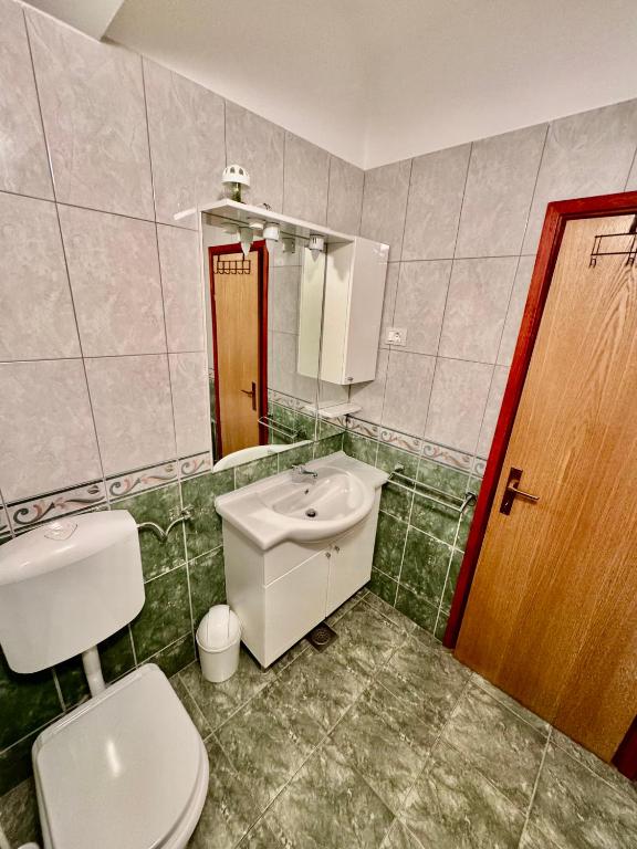Koupelna v ubytování Apartments Dani