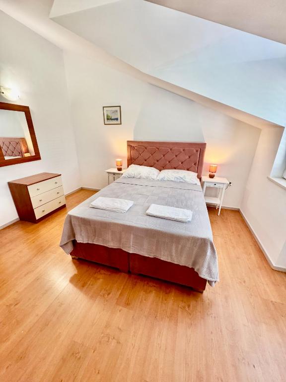 Postel nebo postele na pokoji v ubytování Apartments Dani