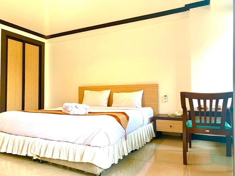 Postel nebo postele na pokoji v ubytování Tanawit Hotel Hua Hin