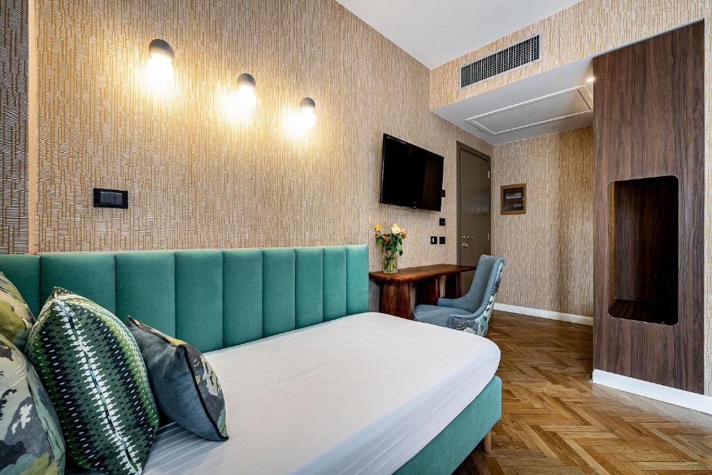 TV a/nebo společenská místnost v ubytování Hotel Duomo Firenze