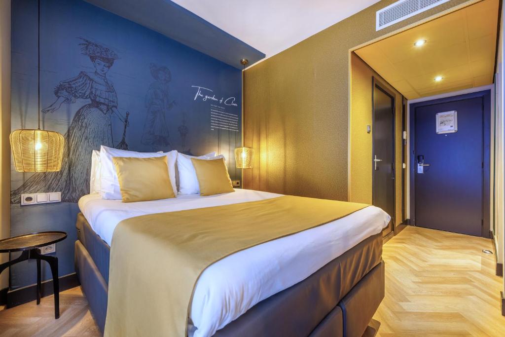 Een bed of bedden in een kamer bij Hotel Die Port van Cleve