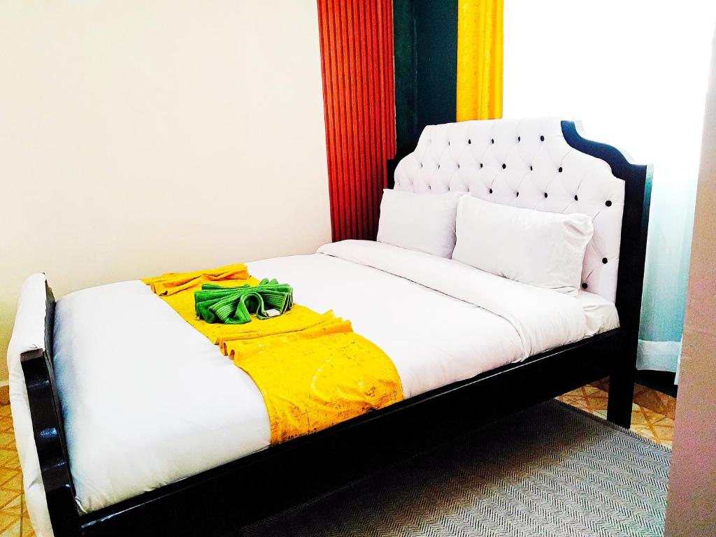 Postel nebo postele na pokoji v ubytování Nanyuki Cozy Haven