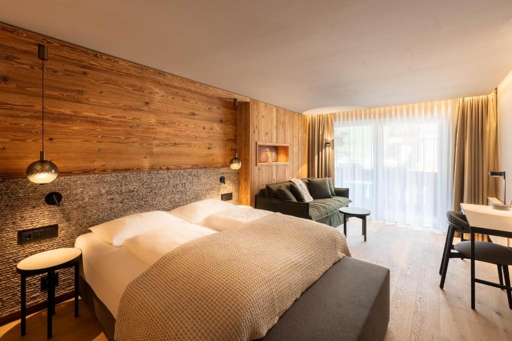 Postel nebo postele na pokoji v ubytování Premium Activehotel Bergkönig