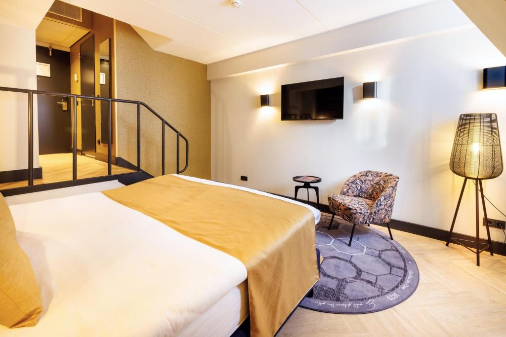 Een bed of bedden in een kamer bij Hotel Die Port van Cleve