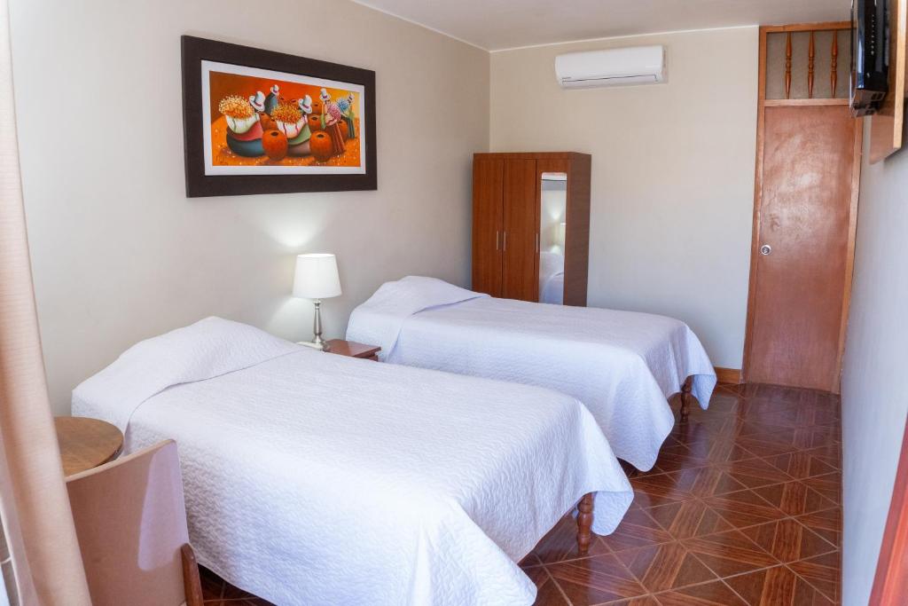 Postel nebo postele na pokoji v ubytování Hotel Curasi