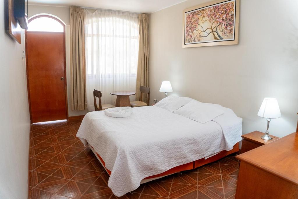 Postel nebo postele na pokoji v ubytování Hotel Curasi
