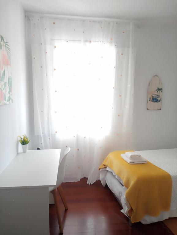 Posteľ alebo postele v izbe v ubytovaní CASA AMELIA Apartamento Bajo con terraza y jardín Apartamento 1ªPlanta