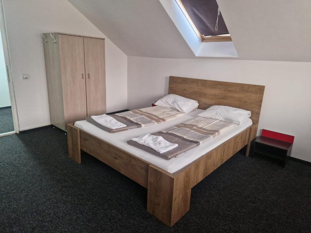 Postel nebo postele na pokoji v ubytování BigCitty Rooms