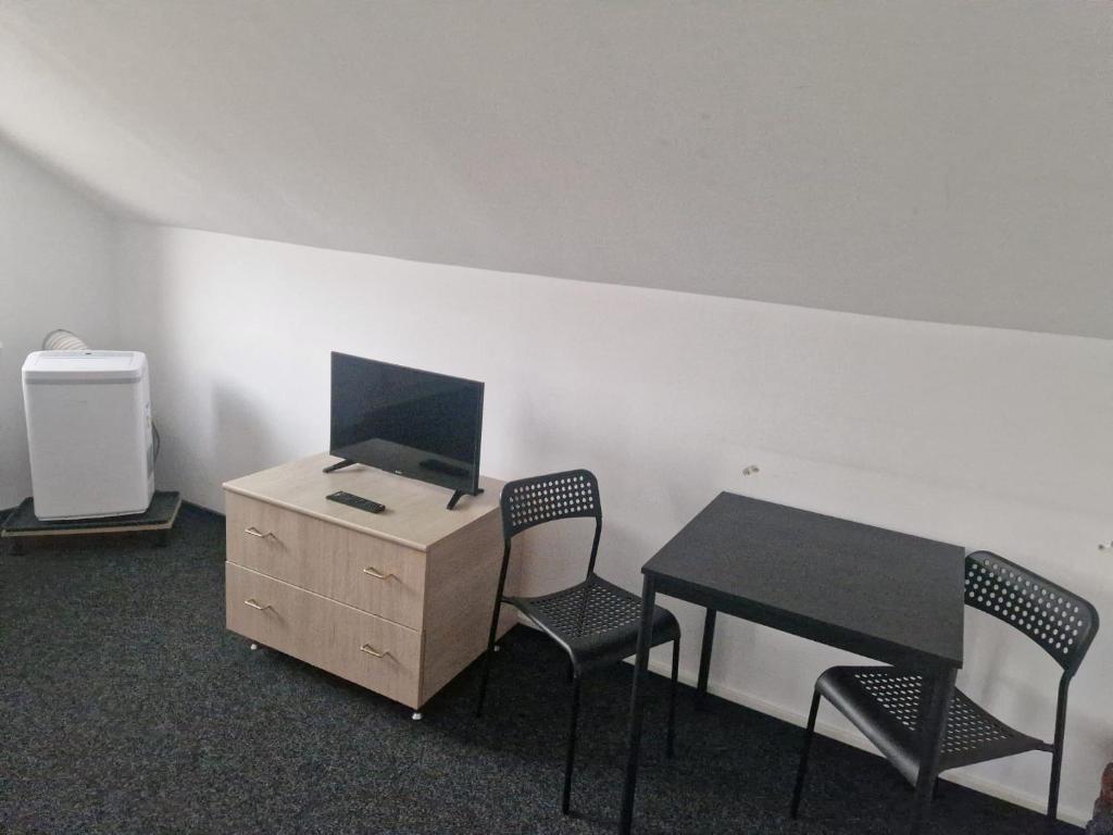 TV a/nebo společenská místnost v ubytování BigCitty Rooms