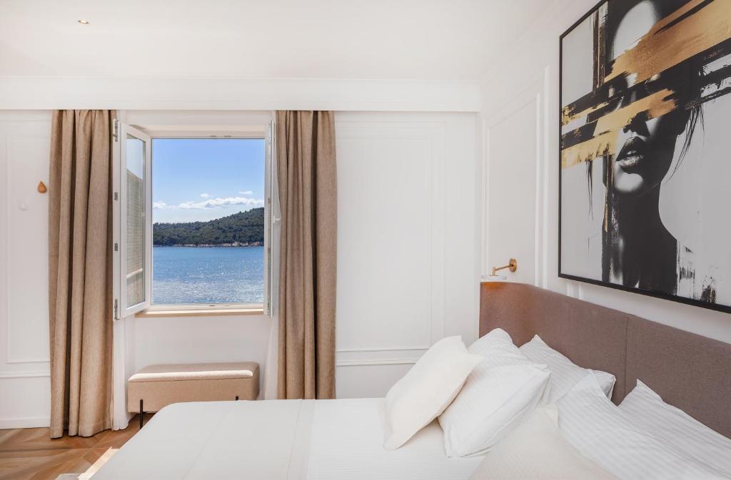 Postel nebo postele na pokoji v ubytování Ragusina luxury apartments