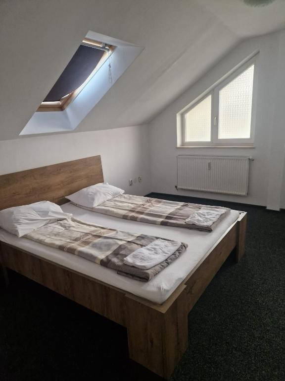 Postel nebo postele na pokoji v ubytování BigCitty Rooms