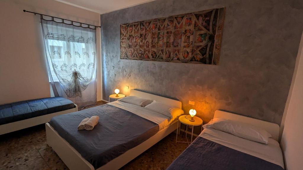 Cama o camas de una habitación en Marconi Rooms and Apartments