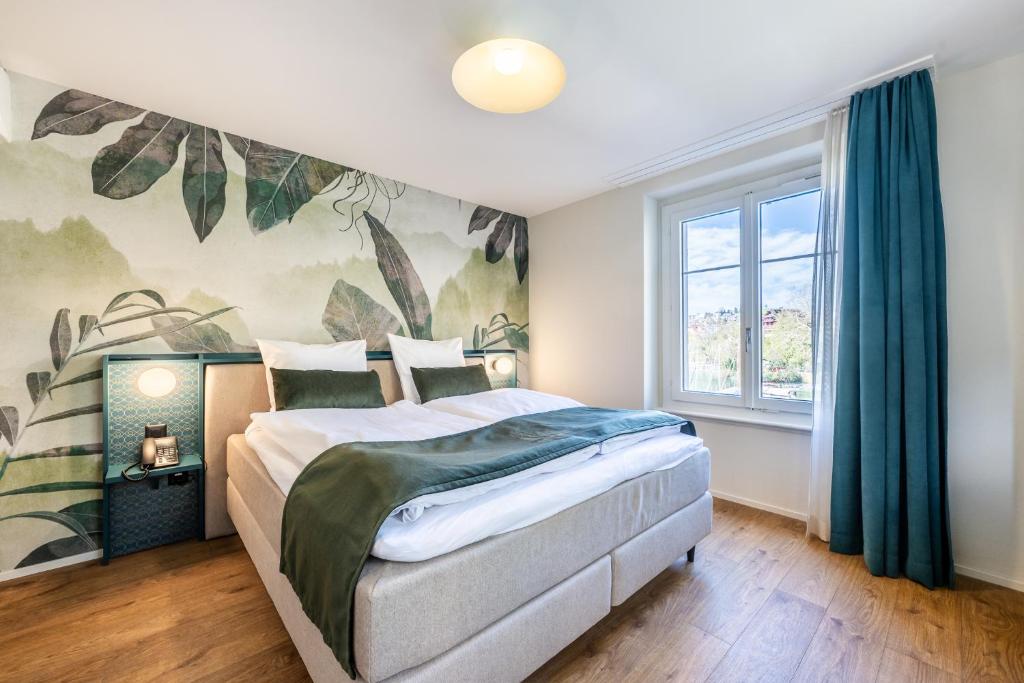 Postel nebo postele na pokoji v ubytování Hotel Central am See