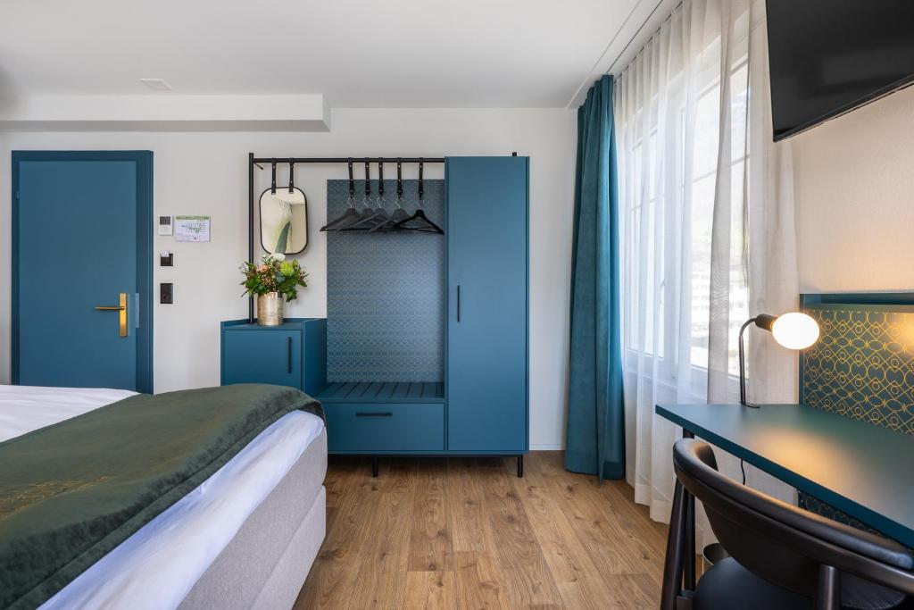 Postel nebo postele na pokoji v ubytování Hotel Central am See