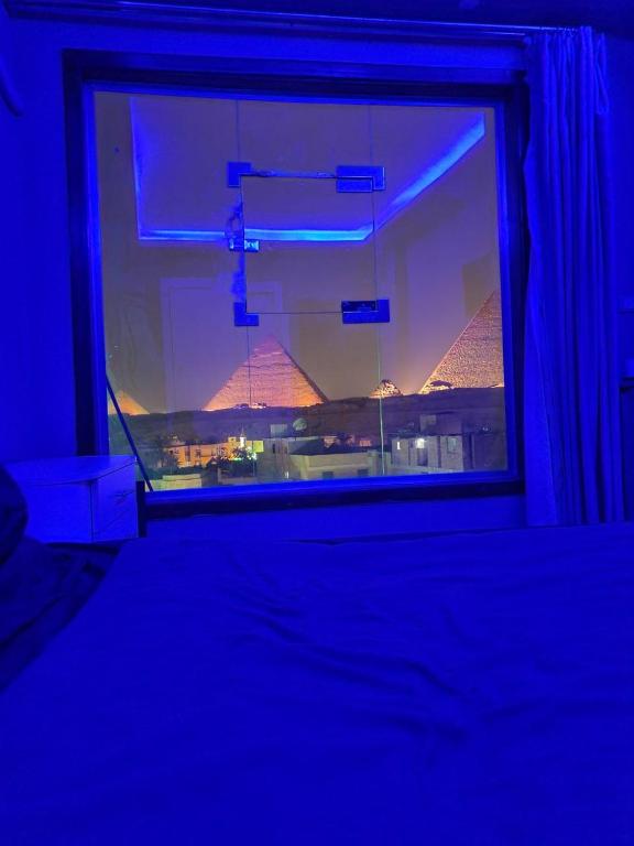 Postel nebo postele na pokoji v ubytování Pyramids INN