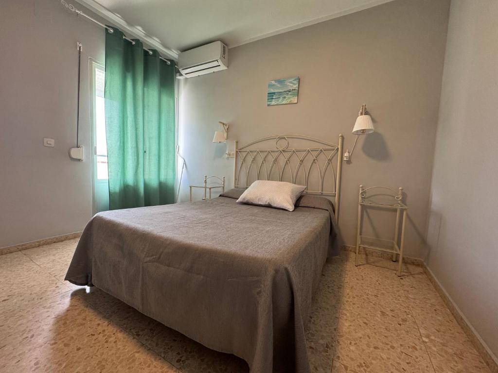 Postel nebo postele na pokoji v ubytování Hostal Miramar
