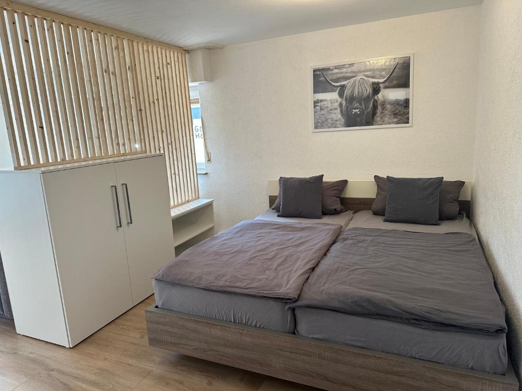 a bedroom with a large bed in a room at Gästehaus Heimatliebe in Heimbach