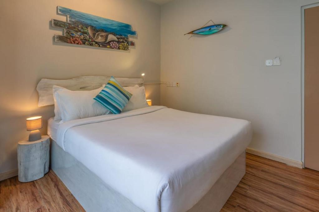 Postel nebo postele na pokoji v ubytování Coquillage Inn