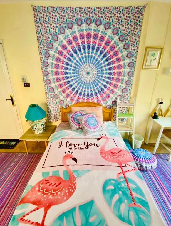 a bedroom with two pink flamingos on a bed at BlueHostel in Cairo