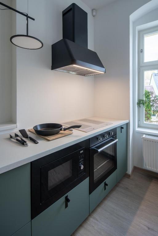 Kuchyň nebo kuchyňský kout v ubytování Graudenz - Cozy Apartments